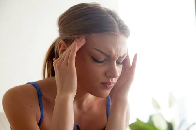 woman suffering from migraines